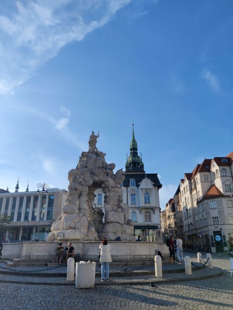 Parnas Fountain in Brno's Cabbage Market Square with the Old Town Hall tower visible in the background. Complete Brno 3-day itinerary
