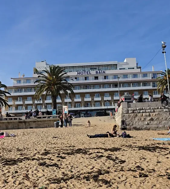 View of Hotel Baía Cascais from Praia da Ribeira beach on a sunny day