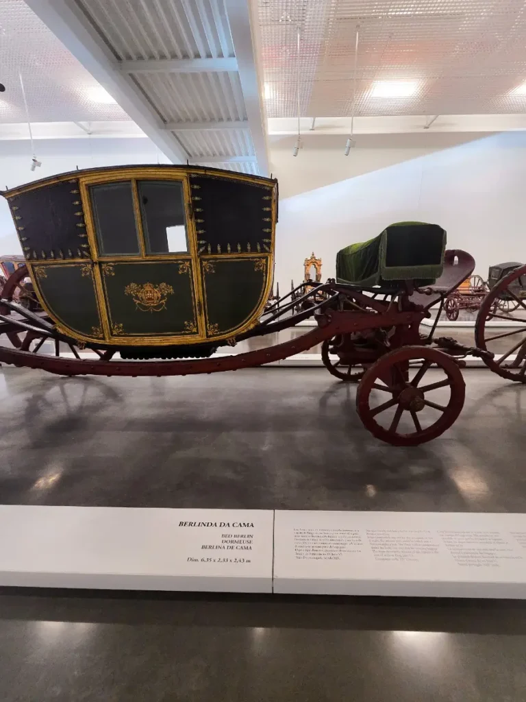 Historic royal carriage on display inside the National Coach Museum in Belém, Lisbon, Portugal.