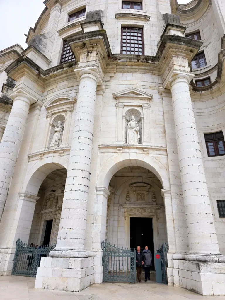 Front façade of the National Pantheon in Lisbon, Portugal, featuring tall columns and stone statues.